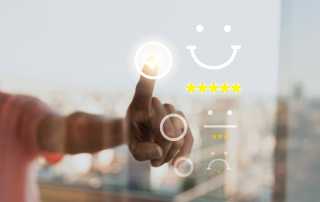 Person selecting a five-star customer experience rating on a digital interface, symbolising customer satisfaction and brand loyalty.